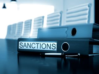 Sanctions on Folder. Blurred Image.