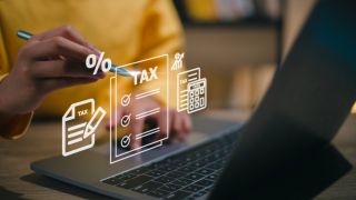 Corporate and individual tax payment concept, woman using computer filling out corporate and personal income tax return, VAT and property tax of business.